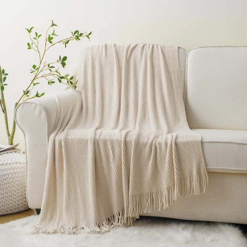 Battilo Home chenille throw blankets layered on an armchair