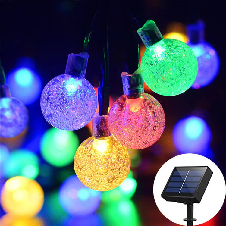 T SUN Lighting solar outdoor string lights hung across a backyard patio